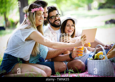 Group of young people taking a selfie outdoors, having fun Stock Photo