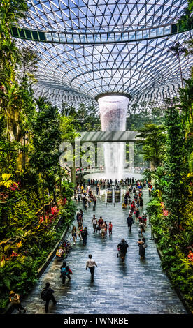 Singapore - Jun 11,  2019: HSBC Rain Vortex. Jewel Changi Airport is a mixed-use development at Changi Airport in Singapore, opened in April 2019. Stock Photo