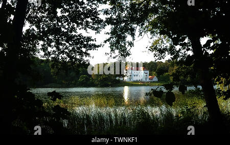 Berlin, Germany. 22nd Mar, 2016. The Grunewald hunting lodge can be seen in the morning between the trees. Credit: Paul Zinken/dpa/Alamy Live News Stock Photo