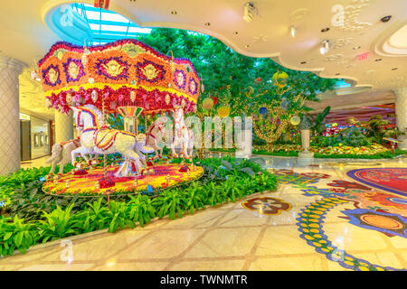 Las Vegas, Nevada, USA - August 18, 2018: animated flowers carousel and beautiful decorations garden indoor luxurious and elegant Wynn Hotel Resort Stock Photo