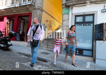 Family tourists crossing a street in Porto Oporto Portugal Europe EU  KATHY DEWITT Stock Photo