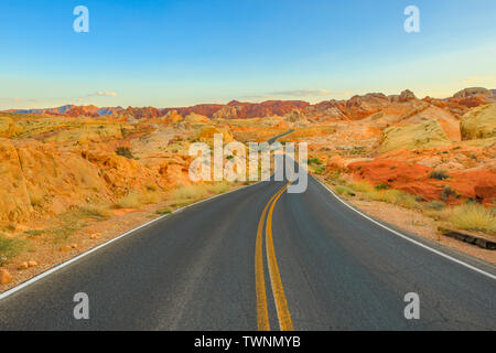 The scenic colorful drive Rainbow Vista Road inside the Valley of Fire at sunset. Valley of Fire is Nevada's oldest state park located in Mojave Stock Photo