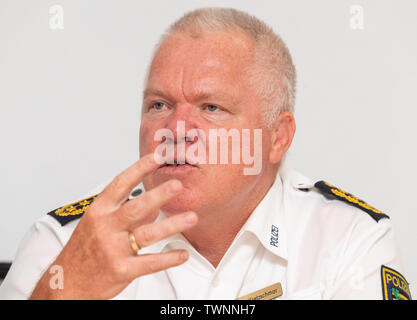 Dresden, Germany. 21st June, 2019. Horst Kretzschmar, president of the state police of Saxony, sits on the podium during the presentation of the new Messenger app, MePol app, to the police in Saxony. Credit: Robert Michael/dpa-Zentralbild/dpa/Alamy Live News Stock Photo
