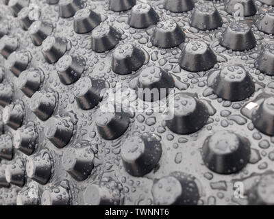 Rain drops on the surface of membrane waterproofing. Stock Photo