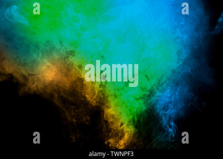 Movement of smoke. Abstract green blue color smoke on black background. Abstract Smoke Clouds. Stock Photo