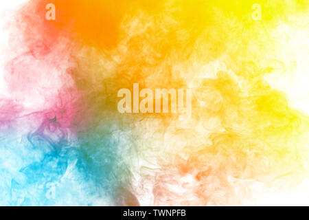 Abstract multi colored smoke flowed on black background. . Abstract yellow tone color smog clouds. Stock Photo