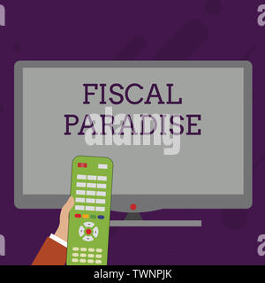 Word writing text Fiscal Paradise. Business photo showcasing The waste of public money is a great concern topic Hand Holding Computer Remote Control i Stock Photo