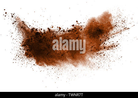 Explosion of deep brown powder on white background. Stock Photo