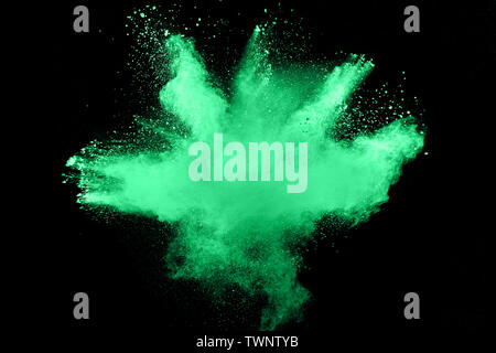 Abstract multicolored dust explosion on black background. Abstract color powder splash on dark background. Stock Photo