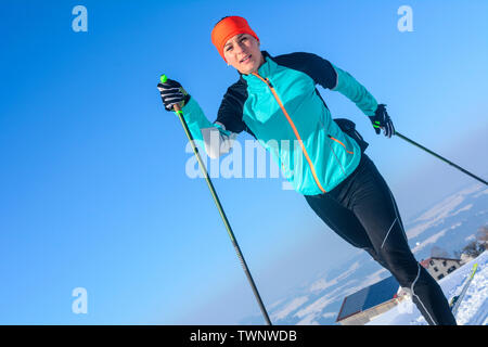 Cross-country skiing - young female athlete in perfect diagonal style Stock Photo