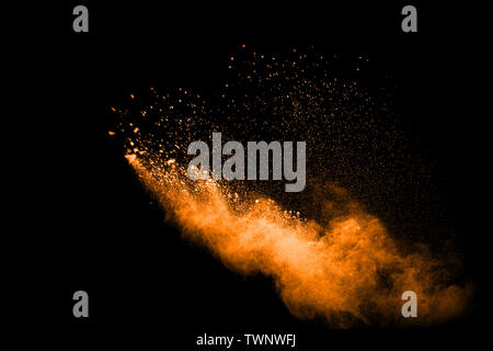 Abstract multicolored dust explosion on black background. Abstract color powder splash on dark background. Stock Photo