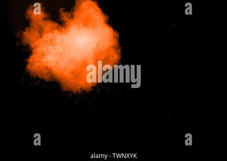 Abstract multicolored dust explosion on black background. Abstract color powder splash on dark background. Stock Photo