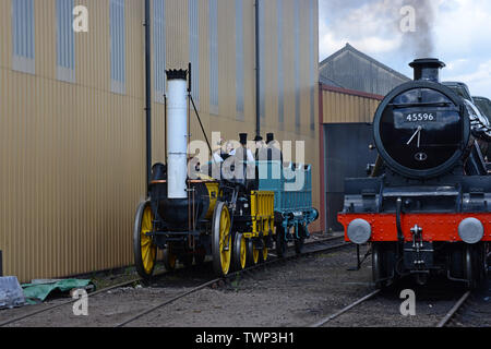 Tyseley, Birmingham, UK. 22nd June 2019.  The official replica of Stephenson’s famous Rocket on display and running at the Tyseley locomotive works open weekend. Rocket was built for the The Rainhill Trials in October 1829 for the then nearly-completed Liverpool and Manchester Railway and was the only locomotive to complete the trials. G.P. Essex/Alamy Live News Stock Photo