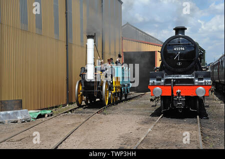 Tyseley, Birmingham, UK. 22nd June 2019.  The official replica of Stephenson’s famous Rocket on display and running at the Tyseley locomotive works open weekend. Rocket was built for the The Rainhill Trials in October 1829 for the then nearly-completed Liverpool and Manchester Railway and was the only locomotive to complete the trials. G.P. Essex/Alamy Live News Stock Photo