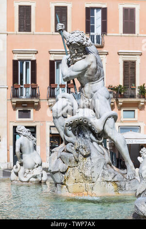 Sculpture of Neptune fighting with an octopus. Detail of The Fountain of Neptune (Italian: Fontana del Nettuno) in Navona Square, Rome, Italy.