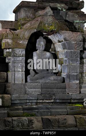 The Buddha statue in Borobudur. Borobudur is a 9th-century Mahayana Buddhist temple. It is the world's largest Buddhist temple. Stock Photo
