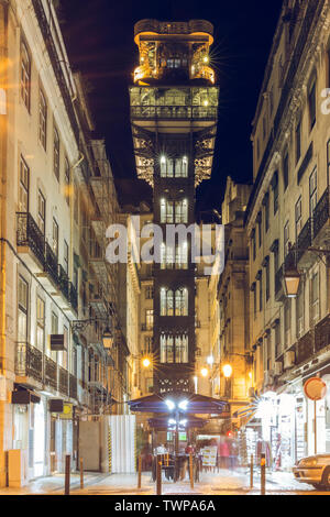 Central view on the elevator Elevador de Santa Justa in the city center of Lisbon. Historical Metal building in the capital of Portugal at night time. Stock Photo