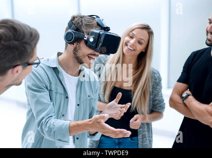 Positive colleagues testing virtual reality glasses Stock Photo