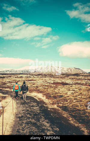 Two Young Women Hiking On A Trail In Iceland With Copy Space Stock Photo