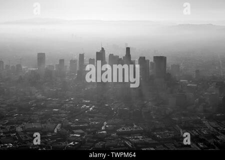 Aerial black and white view of thick summer smog in urban downtown Los Angeles, California. Stock Photo