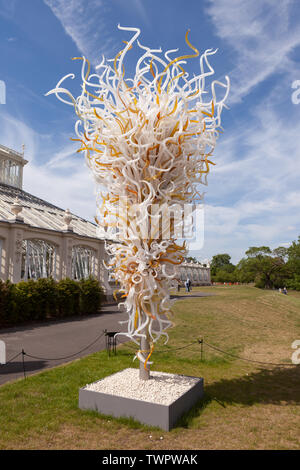 The Opal and Amber Tower is a glass sculpture by contemporary USA artist Dale Chihuly, located outside the Temperate House at Kew Gardens, London, UK. Stock Photo