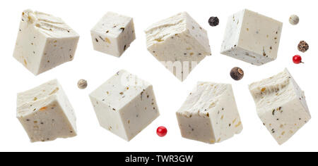 Greek feta cubes with herbs and spices, diced soft cheese isolated on white background Stock Photo