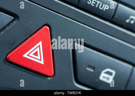 Hazard lights button on car dashboard Stock Photo