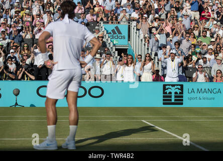 London, UK. 22nd June, 2019.  Feliciano López of Spain looks on as José Clavet (coach of Feliciano López of Spain while Sandra Gago (girlfriend of Feliciano López of Spain) celebrate the semi-final win during the Fever-Tree Tennis Championships Semi Finals 2019 at The Queen's Club, London, England on 22 June 2019. Photo by Andy Rowland. Credit: PRiME Media Images/Alamy Live News Stock Photo