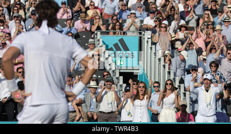 London, UK. 22nd June, 2019.  Feliciano López of Spain looks on as José Clavet (coach of Feliciano López of Spain while Sandra Gago (girlfriend of Feliciano López of Spain) celebrate the semi-final win during the Fever-Tree Tennis Championships Semi Finals 2019 at The Queen's Club, London, England on 22 June 2019. Photo by Andy Rowland. Credit: PRiME Media Images/Alamy Live News Stock Photo