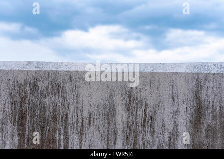 Concrete Gray Wall as Border and blue Sky as Background Stock Photo