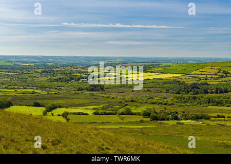 The view across Pembrokeshire countryside and farmland from Carn Menyn in the Preseli Hills on a sunny summer day in June Stock Photo