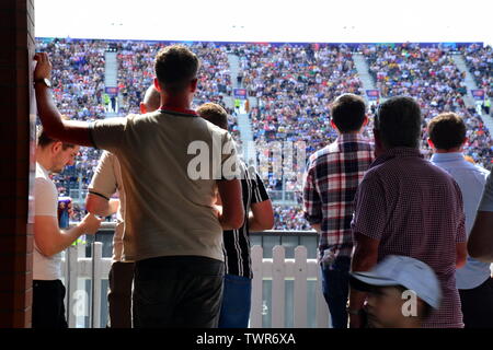 Spectators watch the West Indies v New Zealand cricket match on June 22, 2019, a match in the Cricket World Cup 2019 at Emirates Old Trafford, Manchester. The 2019  International Cricket Council (ICC) Cricket World Cup is being hosted by England and Wales from May 30th to July 14th, 2019. Six matches are being held at Old Trafford, Manchester, more than at any other venue. Stock Photo