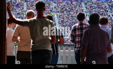 Spectators watch the West Indies v New Zealand cricket match on June 22, 2019, a match in the Cricket World Cup 2019 at Emirates Old Trafford, Manchester. The 2019  International Cricket Council (ICC) Cricket World Cup is being hosted by England and Wales from May 30th to July 14th, 2019. Six matches are being held at Old Trafford, Manchester, more than at any other venue. Stock Photo