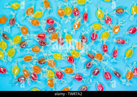 Colorful lollipops and different colored round candy. Top view. Stock Photo
