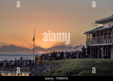 25th April 2019: A large crowd attend the dawn ANZAC service on the beach and beside the surf club at Black Head Beach, New South Wales, Australia Stock Photo