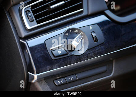 Element of modern luxury car interior switch for front headlights of car parking lights high beam dipped beam and information switch on windshield hea Stock Photo