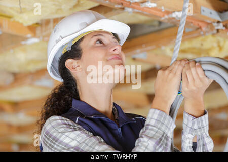 female engineer checking pipes in a construction site Stock Photo