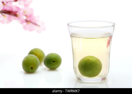 Japanese plum wine called umeshu on white backgroun Stock Photo