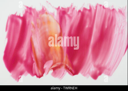 Abstract pink and yellow mix paint isolated on white background Stock Photo