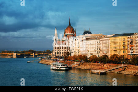A River Danube in Budapest past the Parliament building in summer time and Margaret Bridge Stock Photo