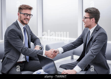 close up. businessman shaking hands with business partner Stock Photo