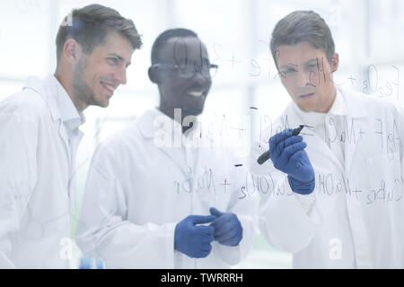 promising scientist makes notes on the Board Stock Photo