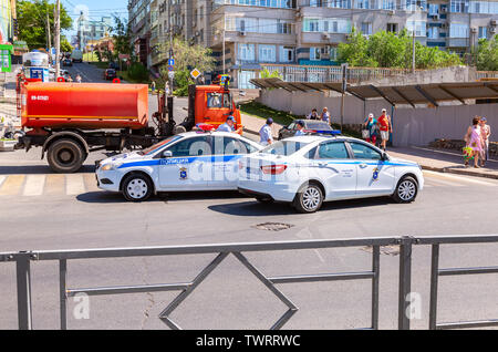 Samara, Russia - June 12, 2019: Heavy trucks Kamaz and police vehicles overlap the street in Samara during the festive mass procession Stock Photo