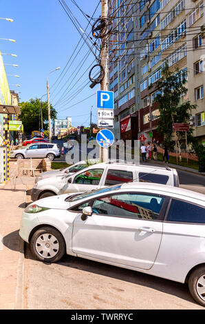 Samara, Russia - June 9, 2019: Different vehicles parked up on the city street in summer sunny day Stock Photo