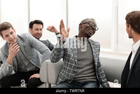close up.cheerful co-workers giving each other a high five Stock Photo