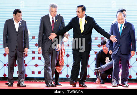 (L-R) ASEAN leaders President of the Republic of the Philippines Rodrigo Roa Duterte, President of the Republic of the Singapore Lee Hsien Loong, Thailand's Prime Minister Prayuth Chan-ocha, and Prime Minister of The Socialist Republic of Vietnam Nguyen Xuan Phuc poses for a group photo during the Opening Ceremony 34th ASEAN Summit in Bangkok. The ASEAN Summit is a biannual meeting held by the members of the Association of Southeast Asian Nations (ASEAN) in relation to economic, political, security, and social-cultural development of Asian countries. Stock Photo