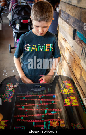 Boy playing video game Stock Photo