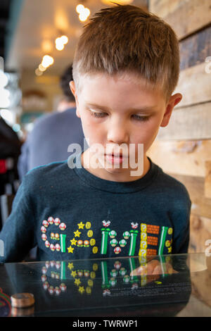 Boy playing video game Stock Photo