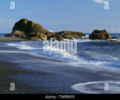 USA, Washington, Olympic National Park, Incoming waves, rocks and scattered pebbles on the sand at Beach 4. Stock Photo