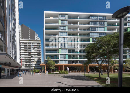 A central town square green space, part of the Discovery Point development of high rise accommodation and apartments at Wolli Creek, Sydney, Australia Stock Photo
